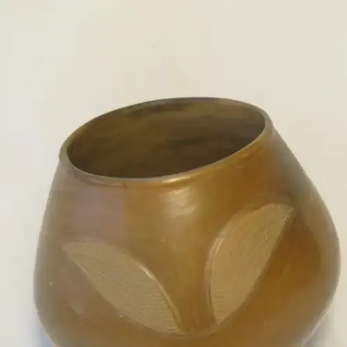 Unique clay pot standing on its own feet