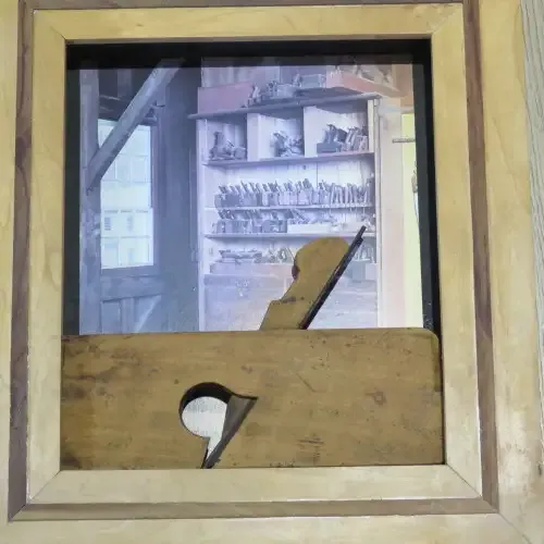 Antique woodwork plane in frame - 39 x 35 cm