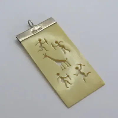 Sterling silver and faux ivory bushman carving motif pendant