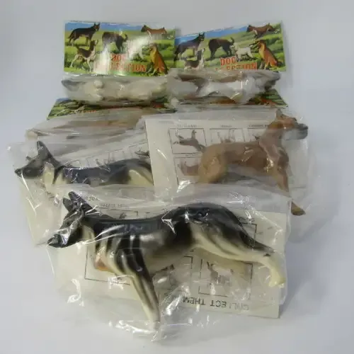 Lot of 7 collectible plastic dogs - some duplicates