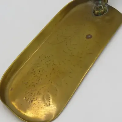 Antique brass and wood silent batter