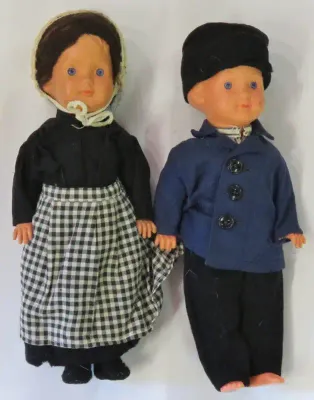 Pair of vintage boy and girl dolls