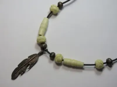 Ethnic necklace with silver feather and bone beads