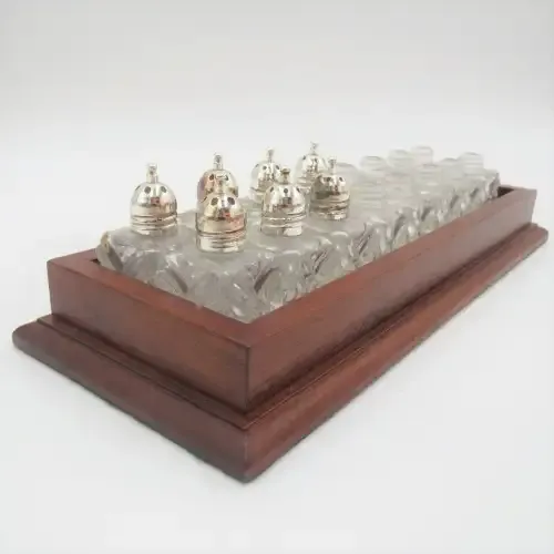 Wooden tray with 16 small salt and pepper shakers - 9 is missing lids