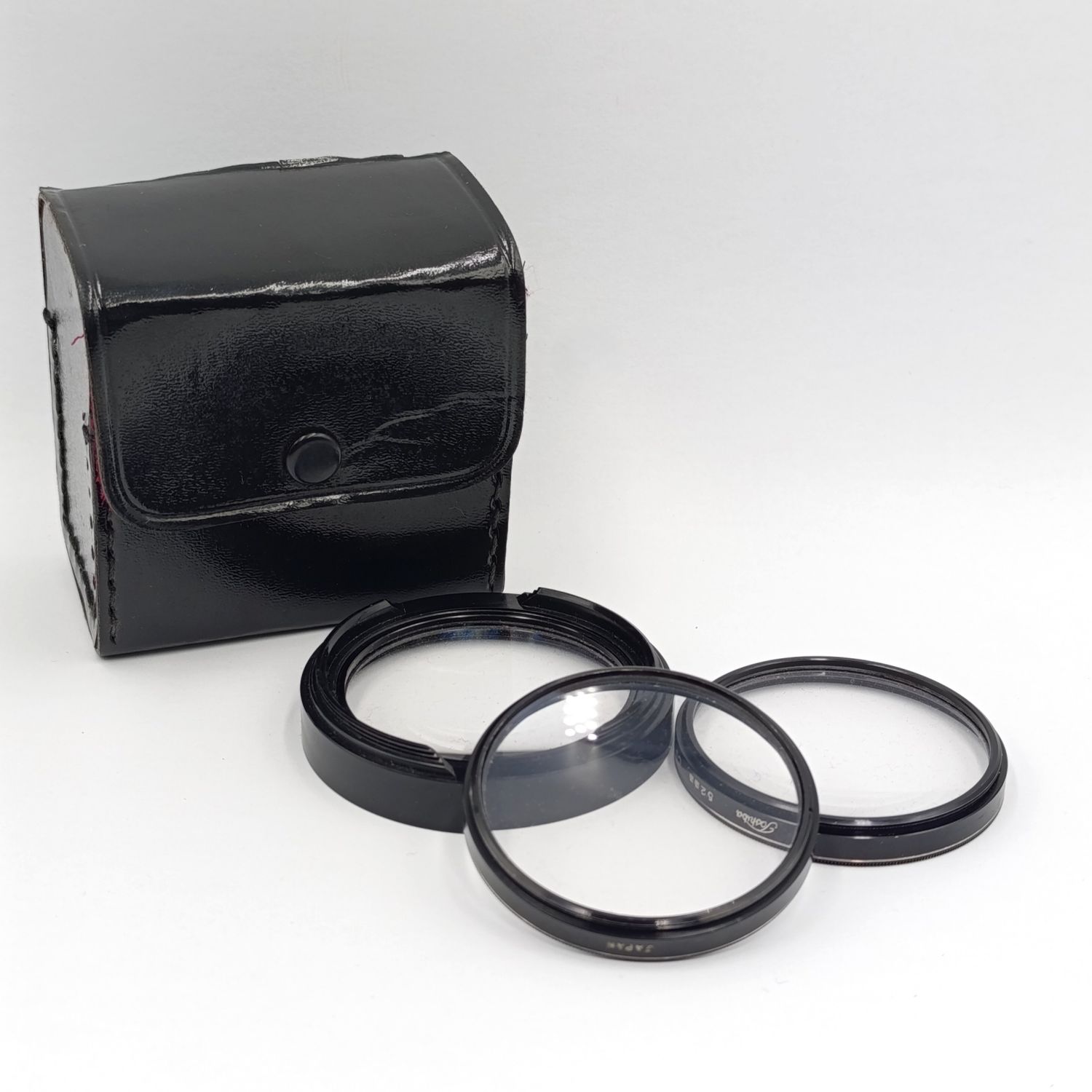 Nikkor and Toshiba lens covers / glare covers 52mm in leatherette box
