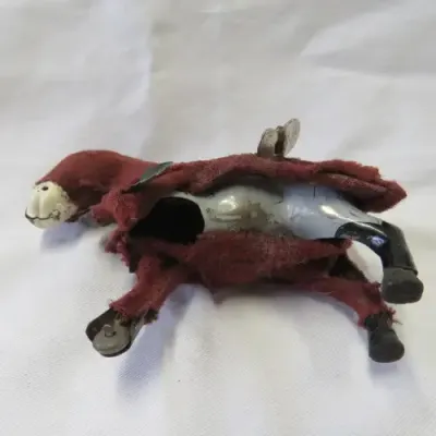 Vintage mechanical donkey with broken leg