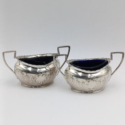 Pair of antique silverplated salt cellars with glass inners