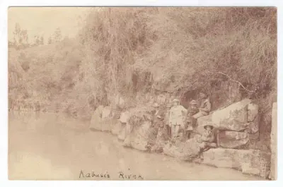 Postcard - Six men posing at Kabusie River - unused
