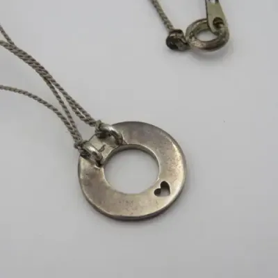 Sterling silver `Circle of Life` pendant with silk string necklace Length 40 cm