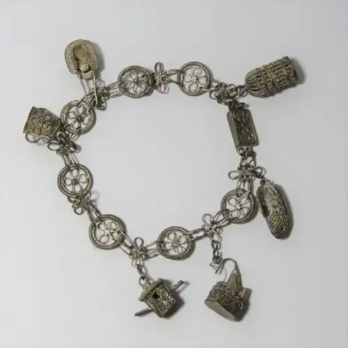 Low Grade silver filigree charm bracelet