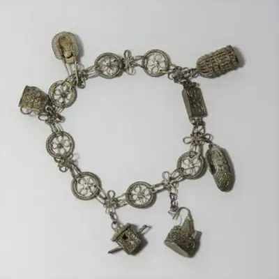 Low Grade silver filigree charm bracelet
