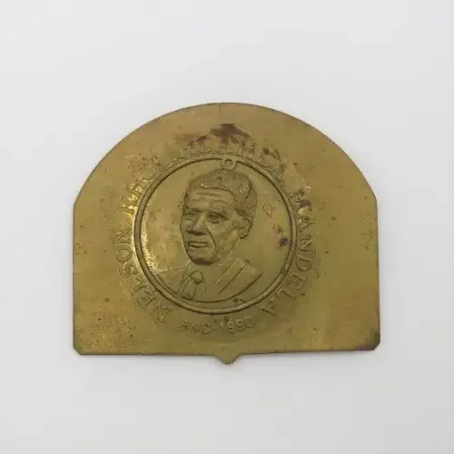 Small brass plate with Nelson Mandela unsure of origin