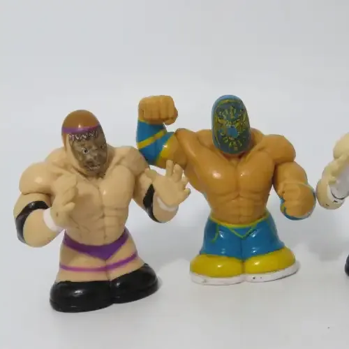 Set of 4 Wicked cool WWE wrestling Thumbpers figurines