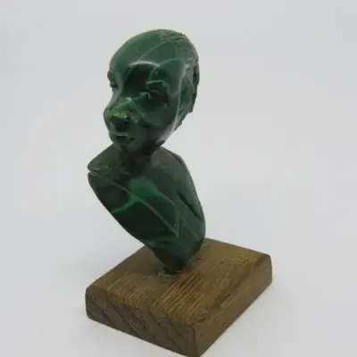 Malachite bust carving on wooden base
