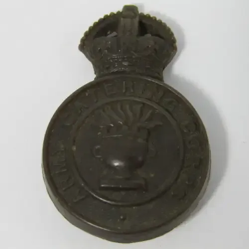 British Army Catering Corps bakelite badge with fold-over clips