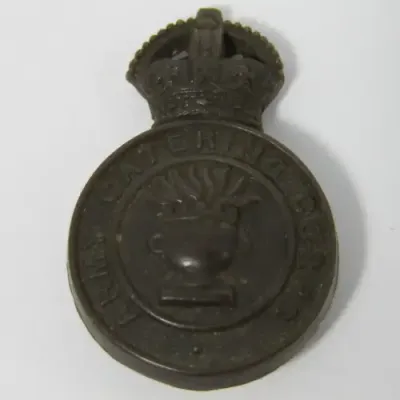 British Army Catering Corps bakelite badge with fold-over clips