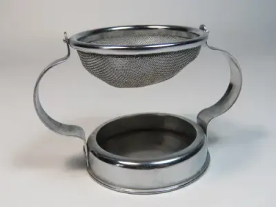 Vintage `nutbrown` tea strainer