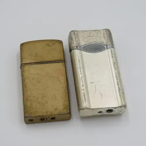 Pair of electric pocket lighters - One working