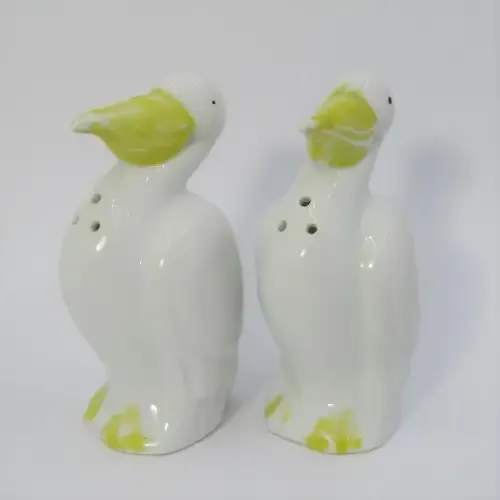 Pair of porcelain Pelican salt and pepper shakers