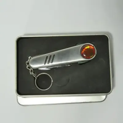 Golfer`s pocket knife tool in gift tin