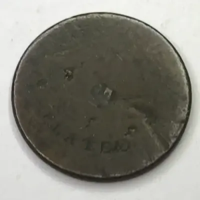Unknown token - Says `plated` on one side - Also a star and some marks