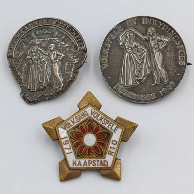 Pair of sterling silver Volkspele brooches plus R10 donation brooch