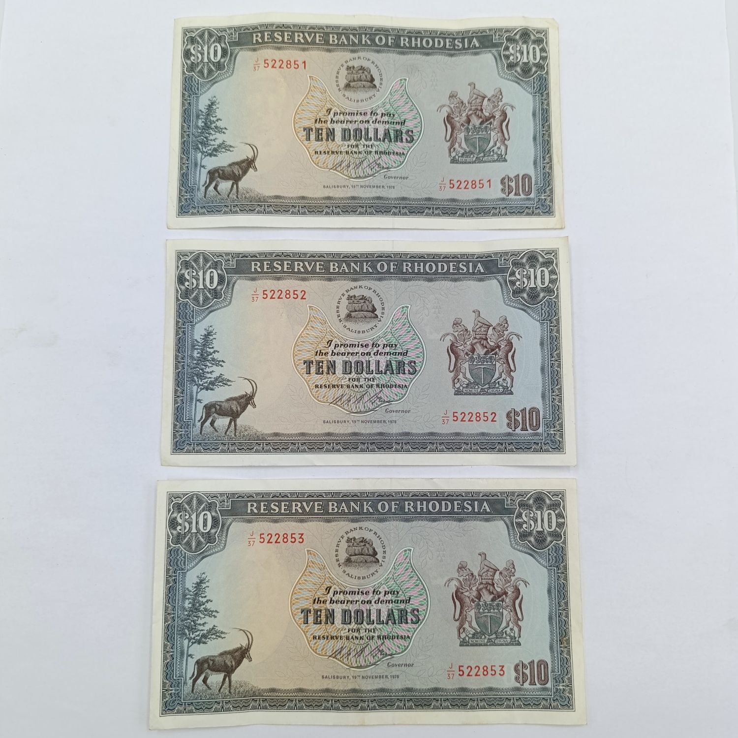 Rhodesia 1975 Lot of 3 x $10 banknotes with consecutive numbers light fold and creases