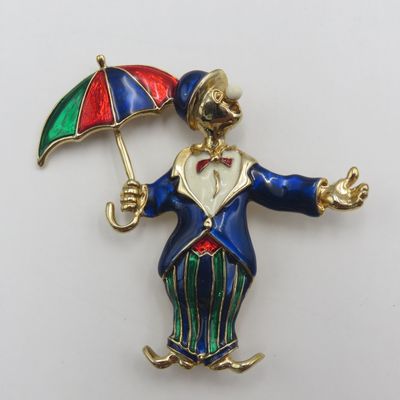 Vintage gold colour with enamel clown brooch