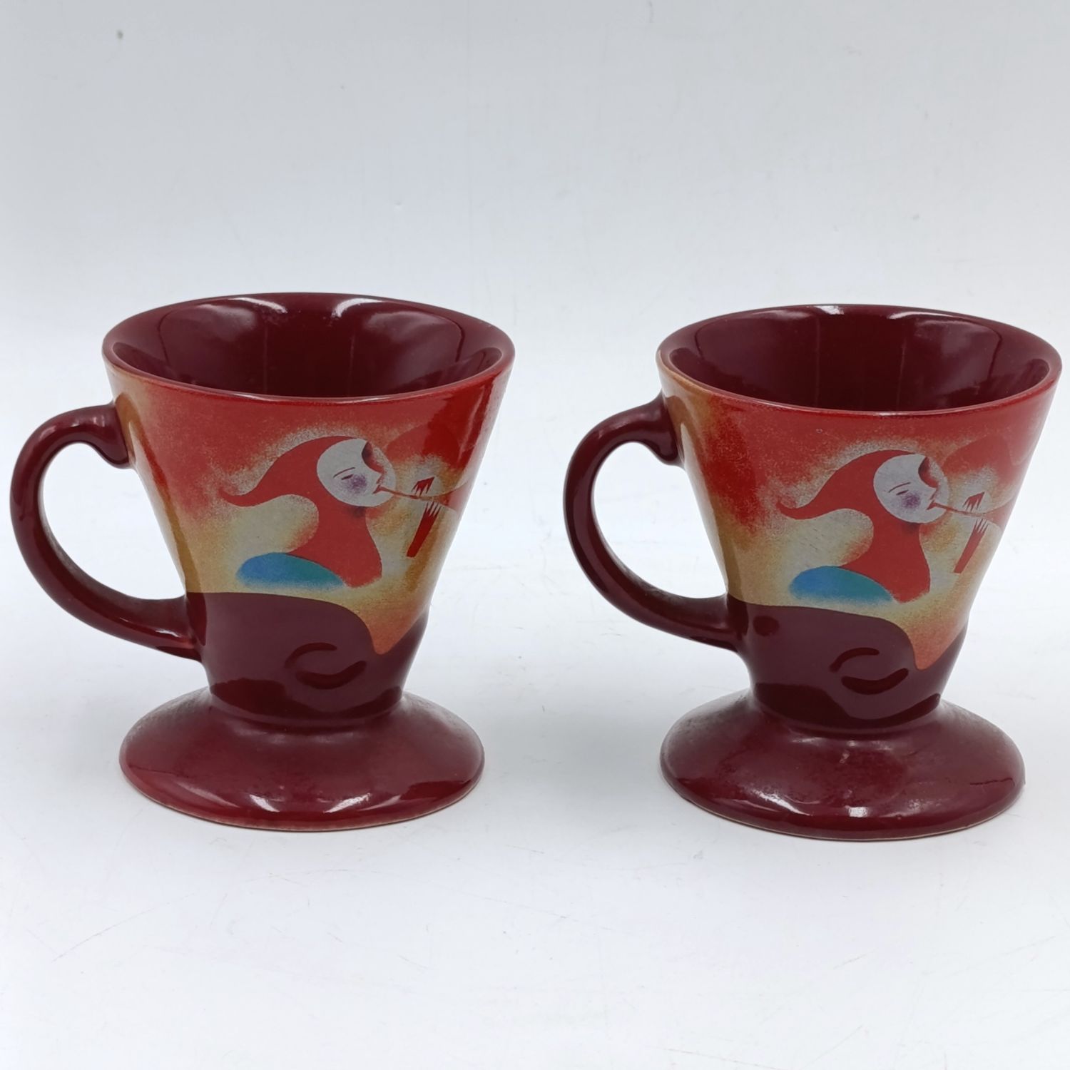 Pair of signed Linda Frichtel Jester coffee cups