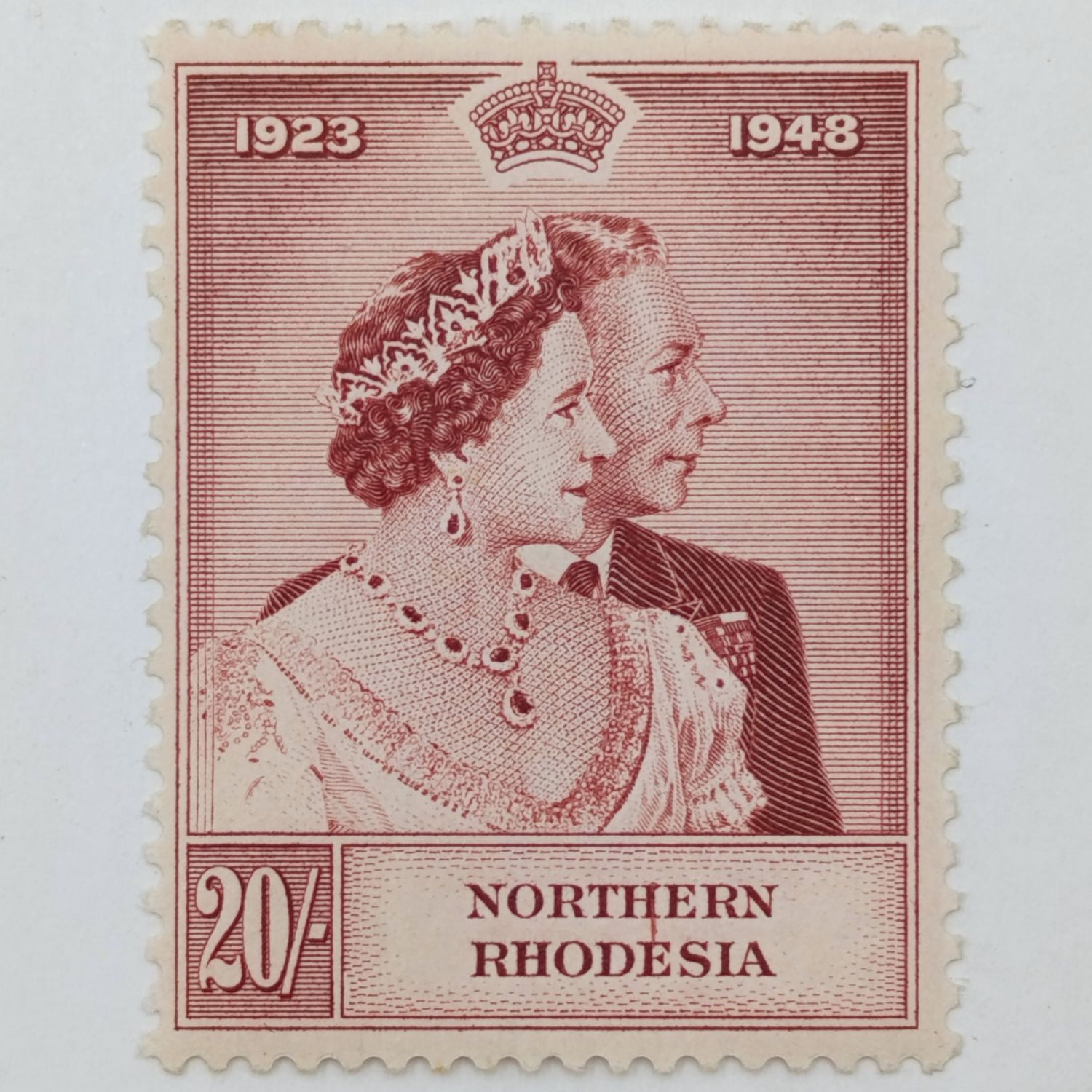 Northern Rhodesia SACC 49 Silver Wedding 20 shilling stamp - claret line from H of Northern to E of Rhodesia