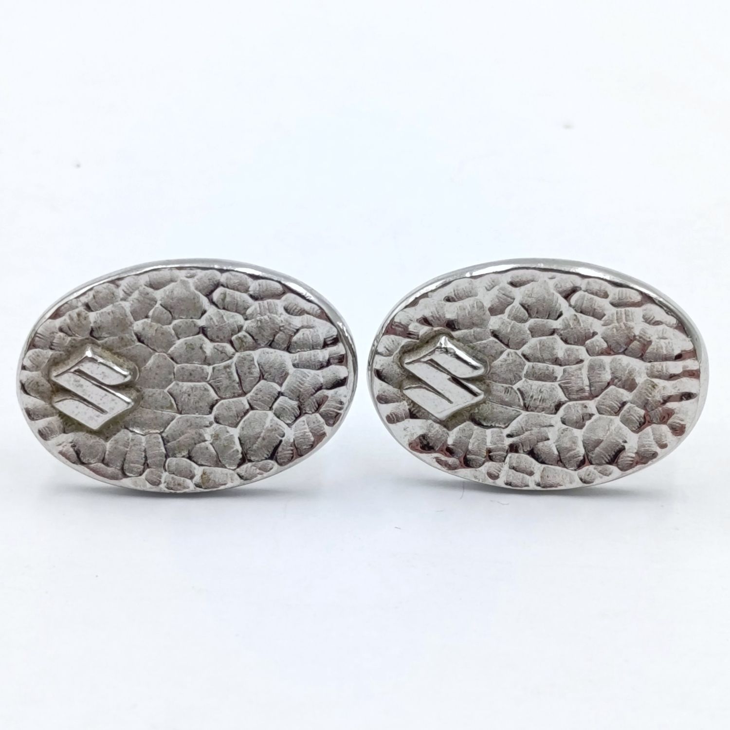 Pair of Suzuki cufflinks