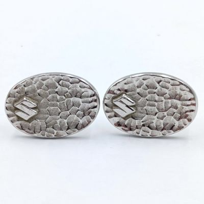 Pair of Suzuki cufflinks