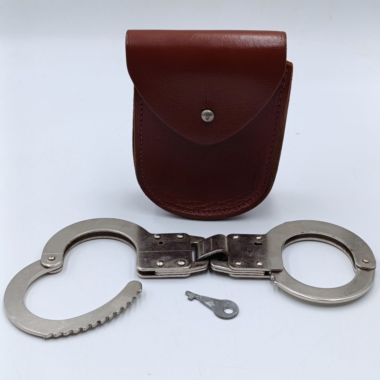 Vintage leather handcuff pouch with handcuffs