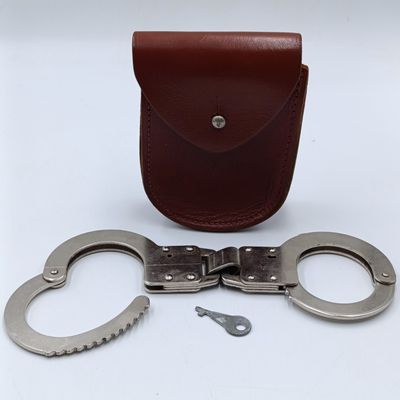 Vintage leather handcuff pouch with handcuffs