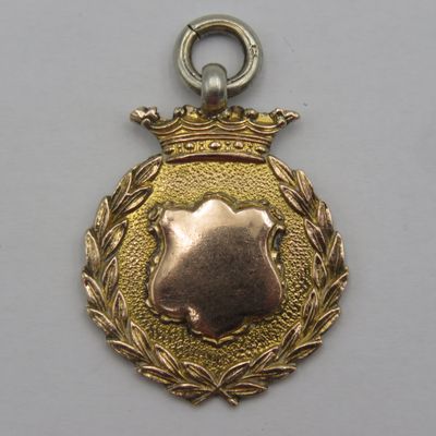 Antique Sterling silver with gold clad boxing medal issued to G Barker Welter-weight - weighs 7,0 grams