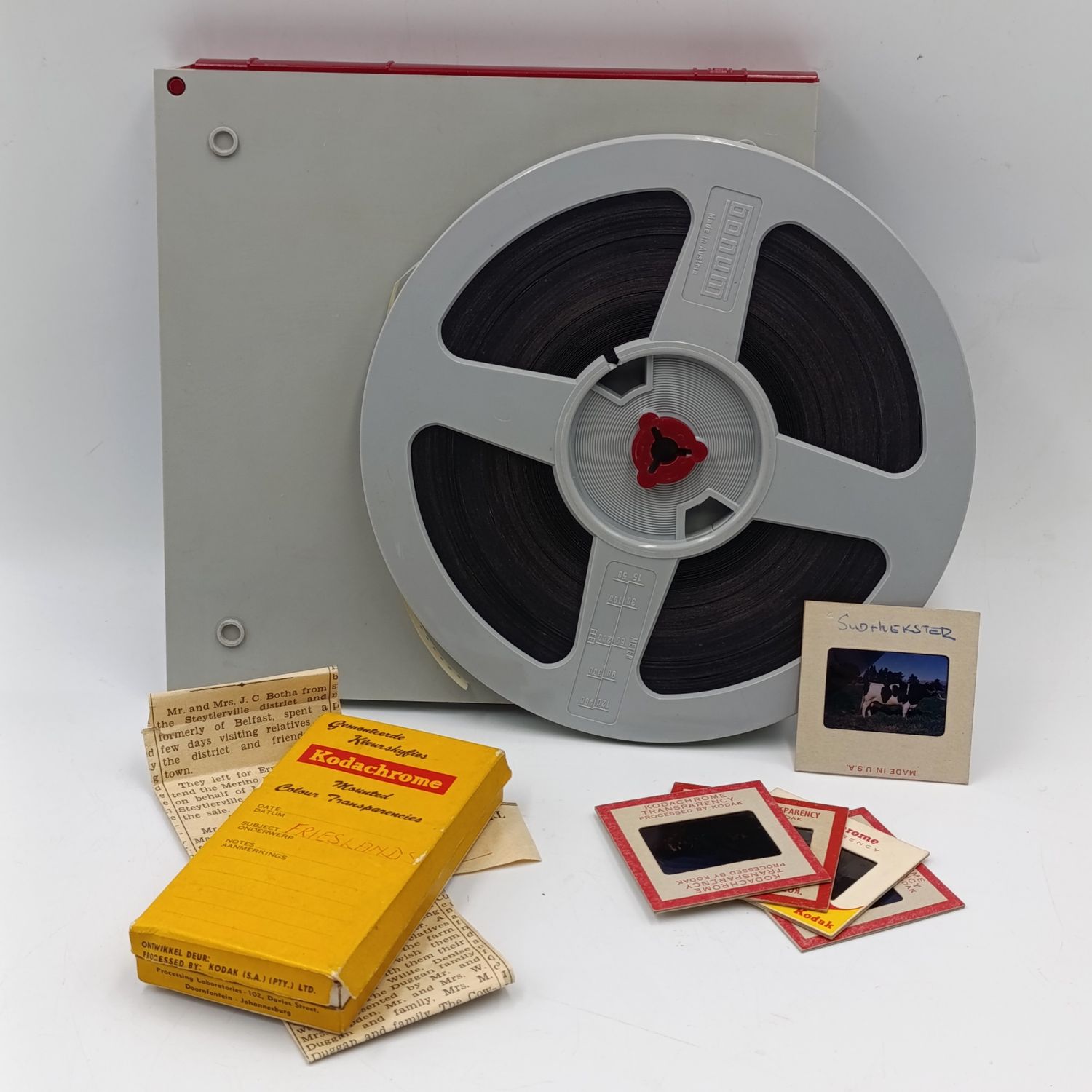 Vintage 8mm film reel and photo slides of Friesland cattle on Sir de Villiers Graaf farm