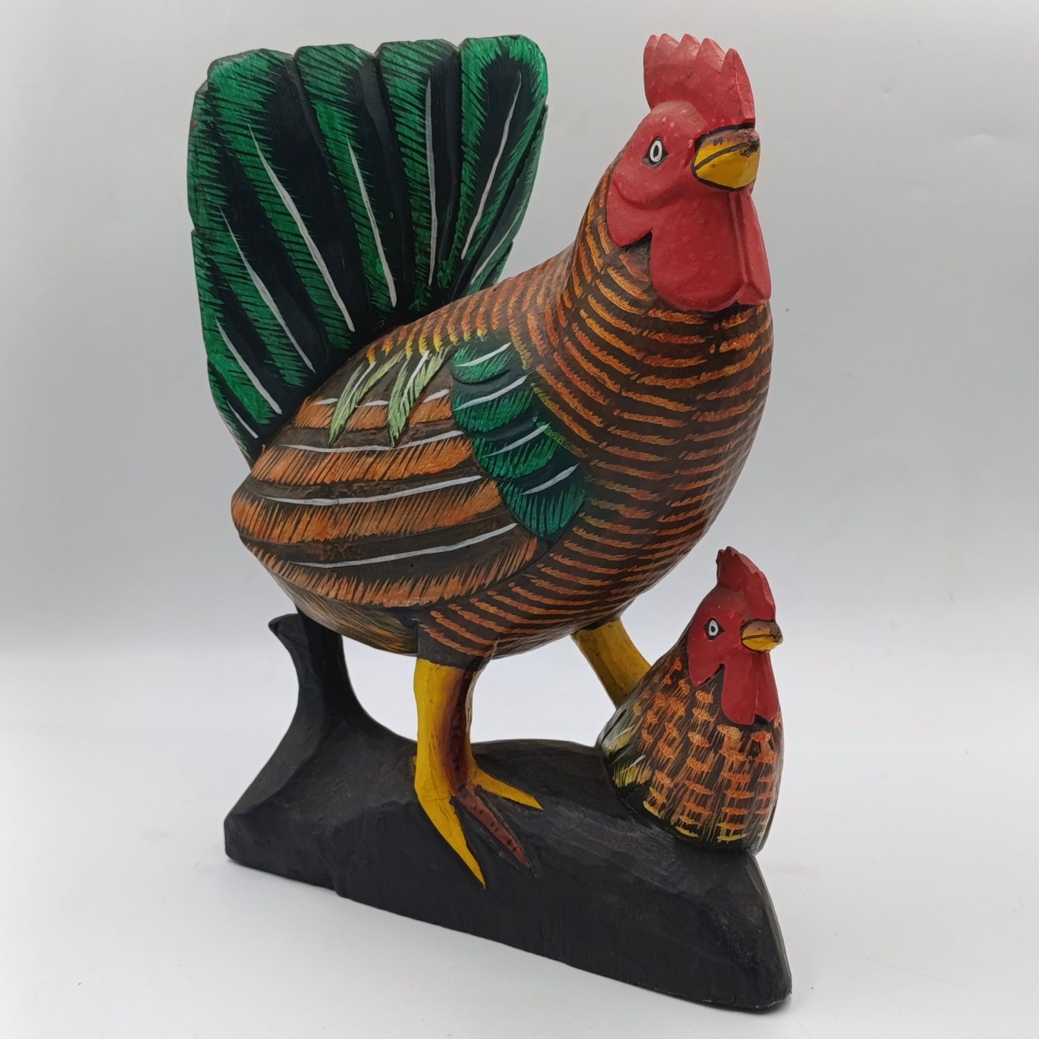 Beautiful wooden carved rooster with chick