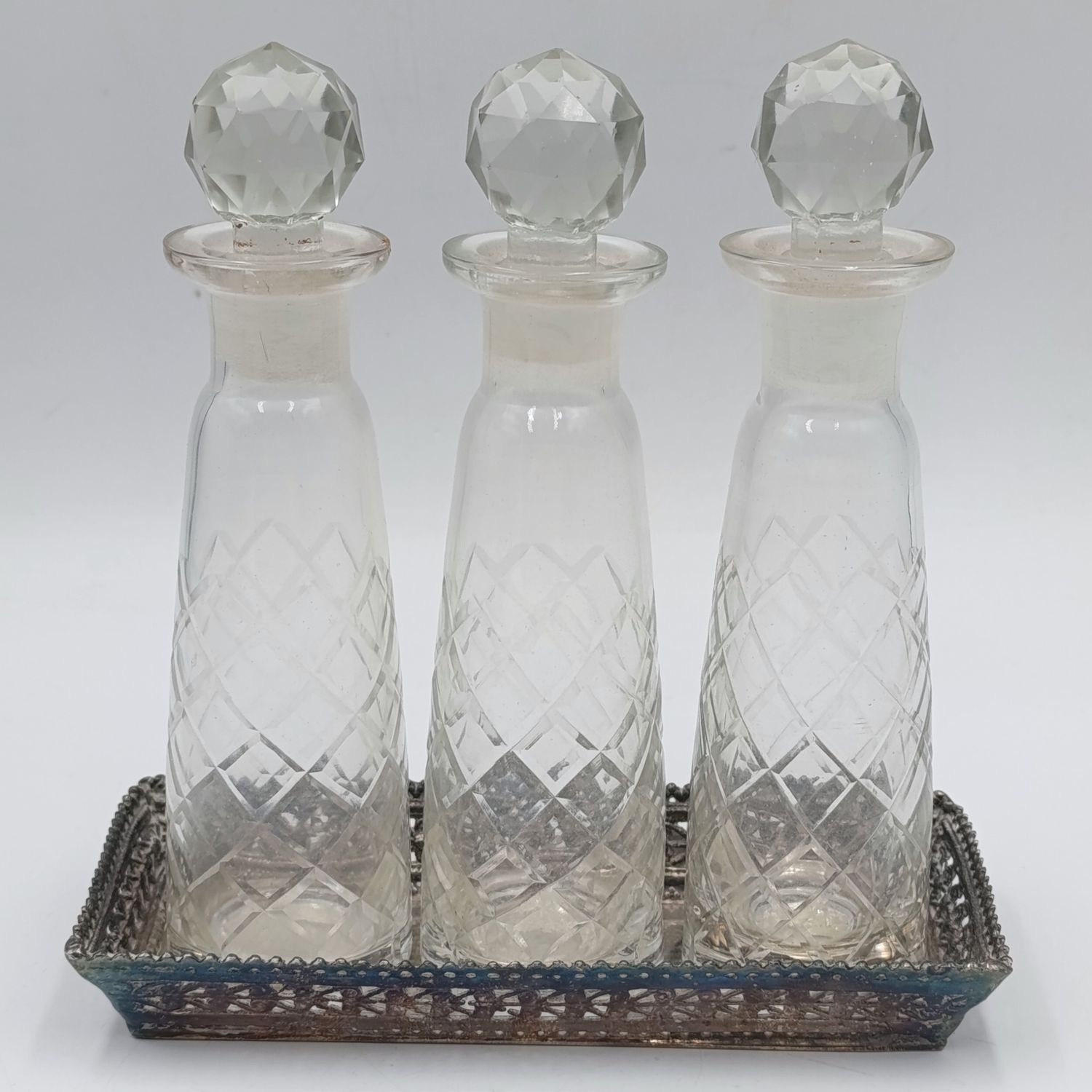 Vintage set of 3 crystal perfume decanters on silverplated tray