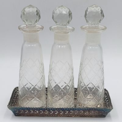 Vintage set of 3 crystal perfume decanters on silverplated tray