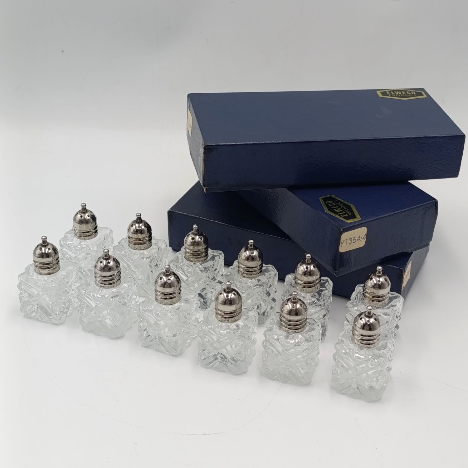 Set of 12 vintage salt shakers in box