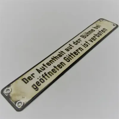 Vintage German enamel sign - `It is forbidden to remain on the stage when the bars are open`
