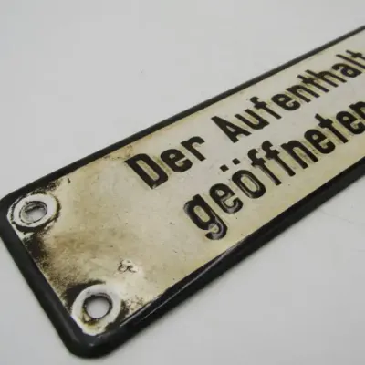 Vintage German enamel sign - `It is forbidden to remain on the stage when the bars are open`