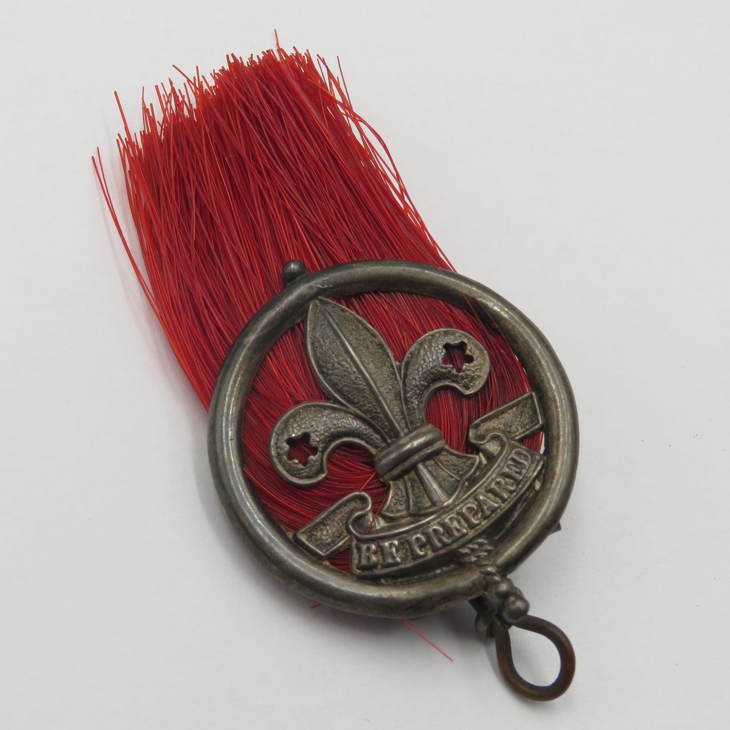 Antique silver scout badge - red plume