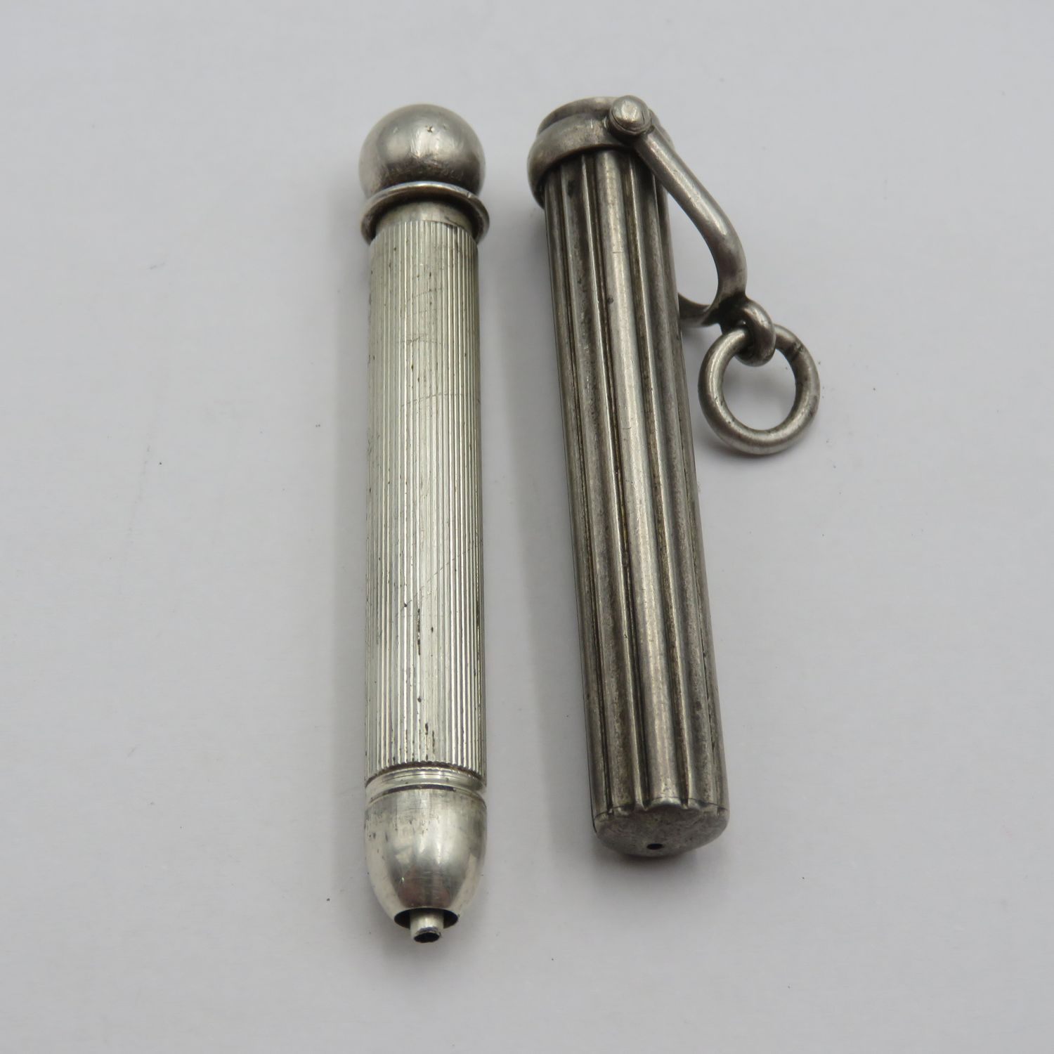 Antique circa 1900 Sterling silver Magic retractable pencil in pendant case
