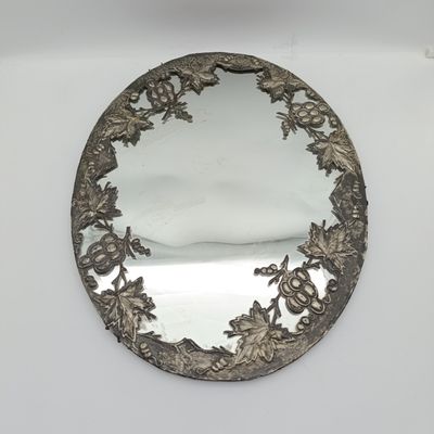 Antique oval mirror with grapevine pewter atrwork frame