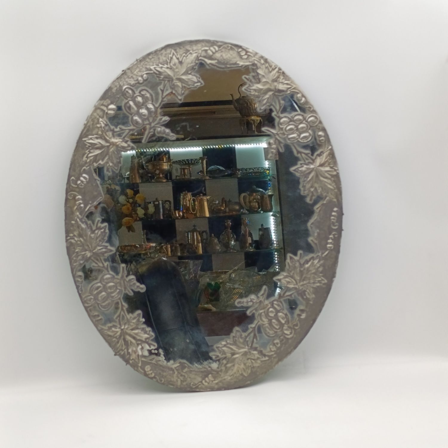 Antique oval mirror with grapevine pewter atrwork frame