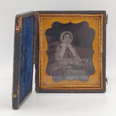 Antique photo frame case with gilt decor and photo of lady