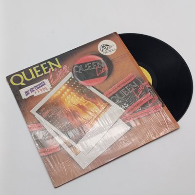 Record  Queen - Live  Label : ( EMI - EXTRA 5 ) Released 1985 South Africa  Media - Very Good Plus (VG+) Sleeve - Very Good Plus (VG+) Inner Sleeve present