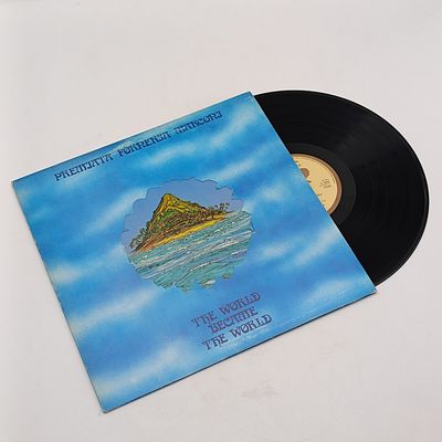 Record  Premiata Forneria Marconi - The World Became The world  Released 1974 United Kingdom  Media - Very Good Plus (VG+) Sleeve - Very Good Plus (VG+) Inner Sleeve present