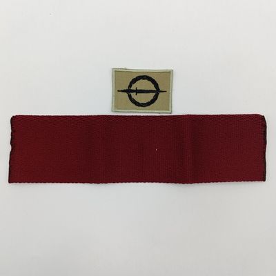 SANDF Special Forces Operator cloth badge with piece of Maroon stable belt material
